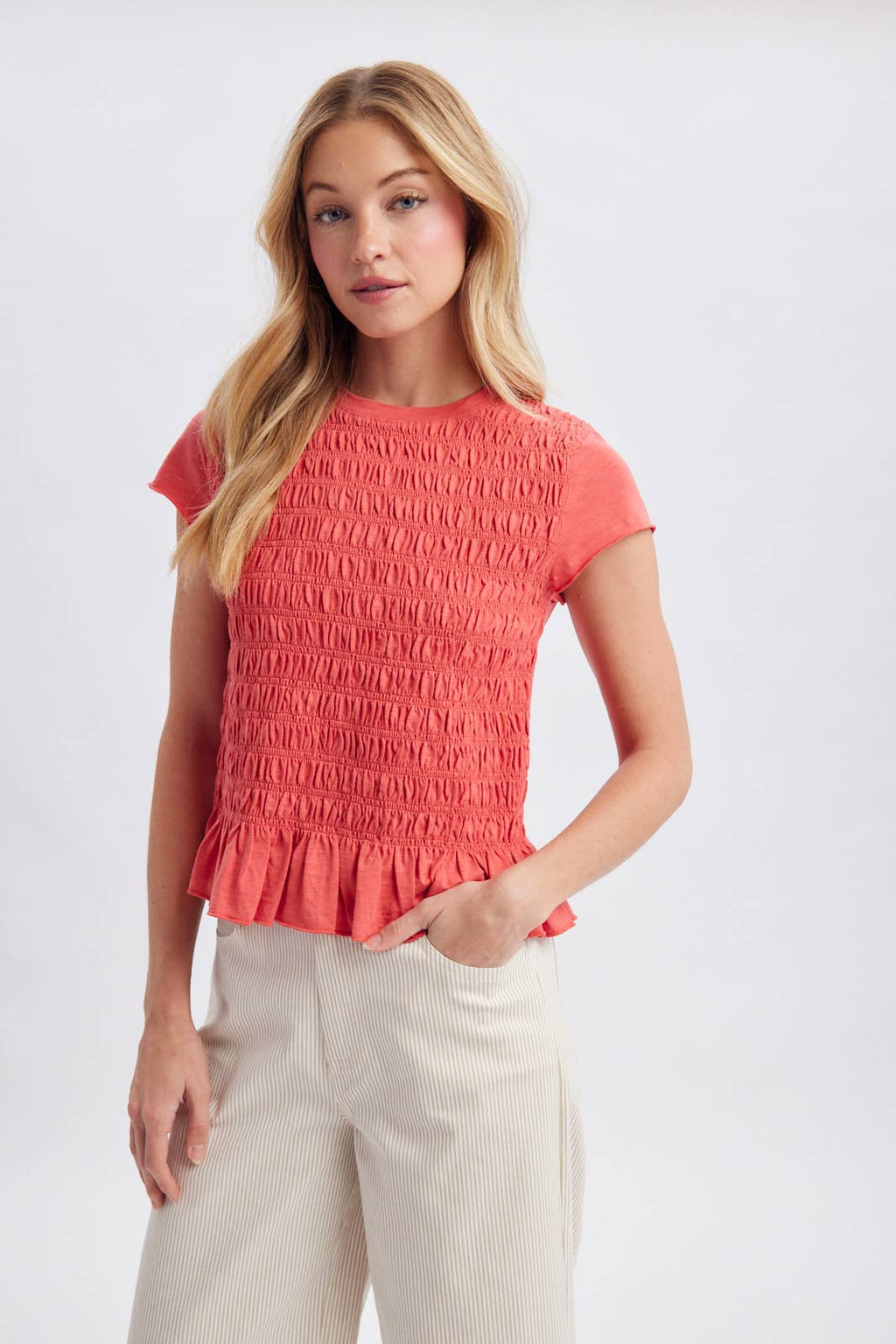 SMOCKED RUFFLE HEM KNIT TOP