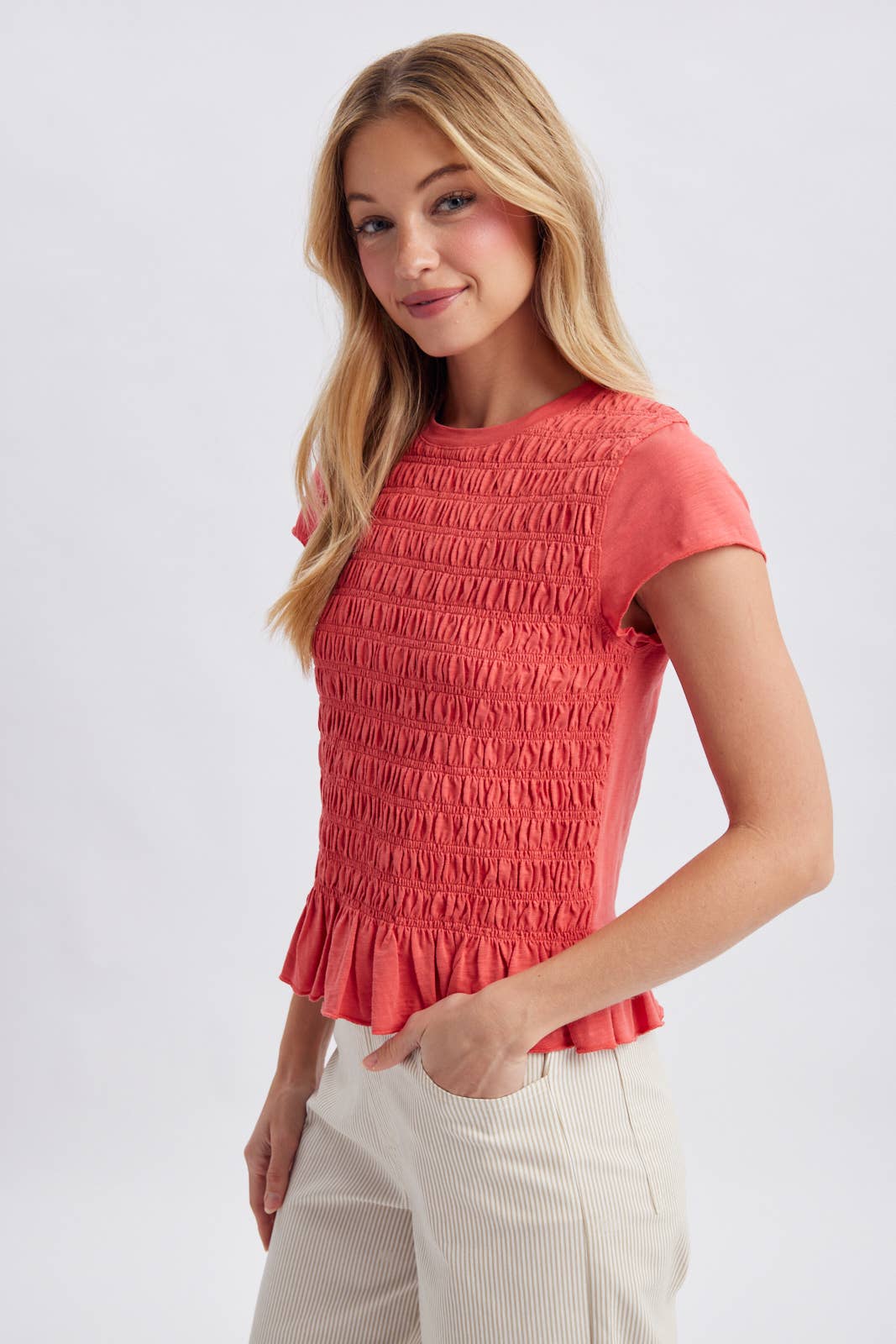 SMOCKED RUFFLE HEM KNIT TOP