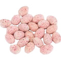 Peppermint almonds coated in dark chocolate on a white background
